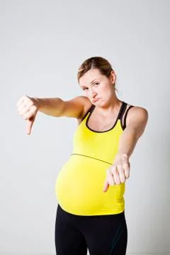 Pregnant woman thumbs down Stock Photos