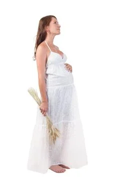Pregnant woman young beautiful pregnant woman with harvest isolated on whi... Stock Photos
