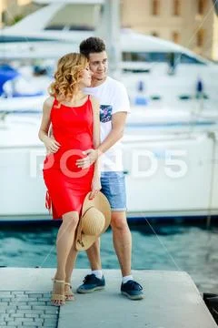 Pregnant young woman with her husband on a journey Stock Photos