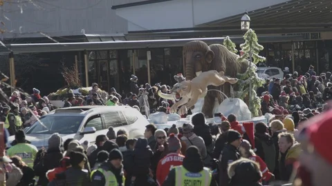 Prehistoric creatures float at santa claus parade in toronto Stock Footage 120037239