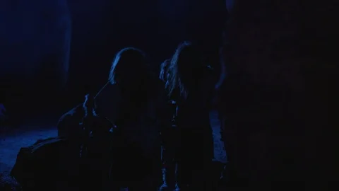 Prehistoric human tribe of primitive neanderthals hunting for food walking in Stock Footage 116631056