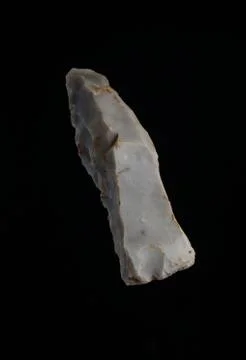 Prehistoric stone axe Stock Photos
