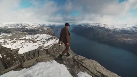Preikestolen view man standing Stockbeeldmateriaal 304581087