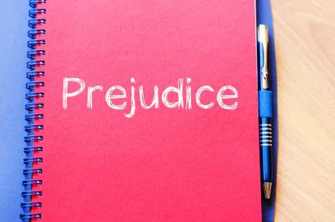 Prejudice write on notebook Stock Photos