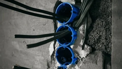 Preliminary Electrical Feed Preparation Involving Multiple Outlet Boxes And Stock Footage 323583246