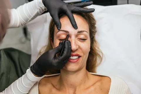 Premicroblading eyebrow design with thread marking technique Stock Photos