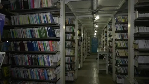 The premises of the large old city library. Large shelves with books. Stock Footage 317749585