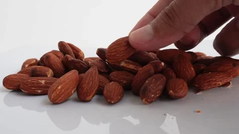 Premium Almonds on a white background Stock Footage 330941374