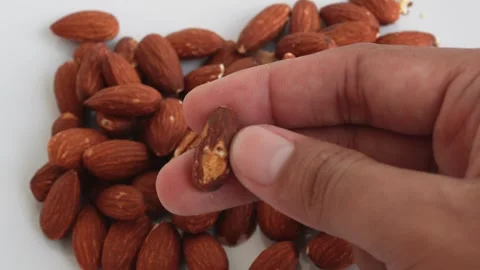 Premium Almonds on a white background 스톡 동영상 330941378