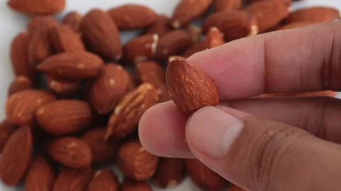 Premium Almonds on a white background Stock Footage 330941383