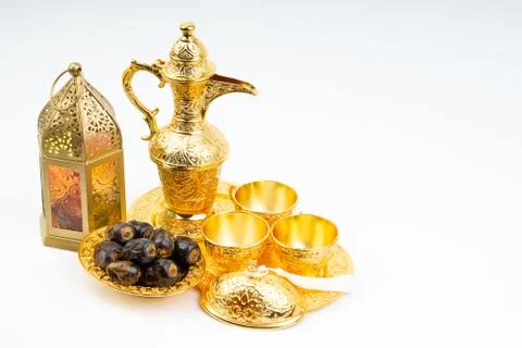 Premium dates, lantern and arabic coffee set on white background. Stock Photos