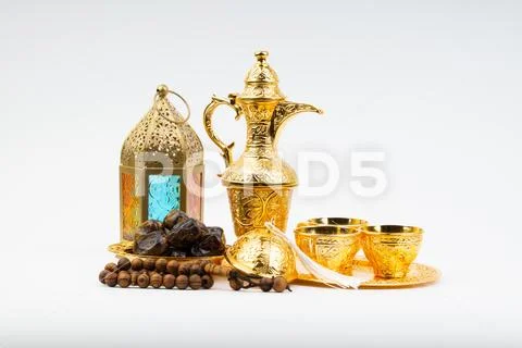 Premium dates, lantern and arabic coffee mug on white background. Stock Photos