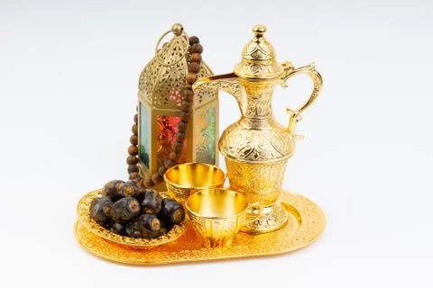 Premium dates, lantern and arabic coffee mug on white background. 库存照片