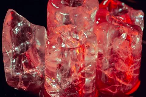 Premium Ice Cubes in Red Light Stock Photos