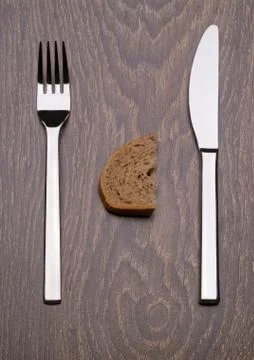 Premium knife and fork. Slice of bread. Start. Stock Photos