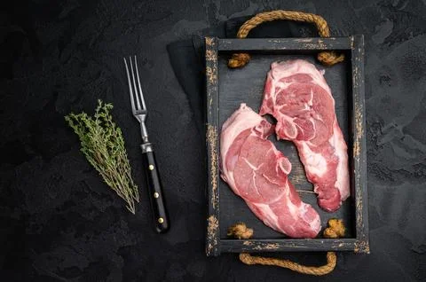 Premium lamb chops with bone in dark moody styling, fresh sirloin saddle me.. Stock Photos
