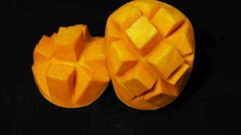 Premium mango fruit cubes showcasing natural sweetness and exotic freshness.. Stock Footage 336646213