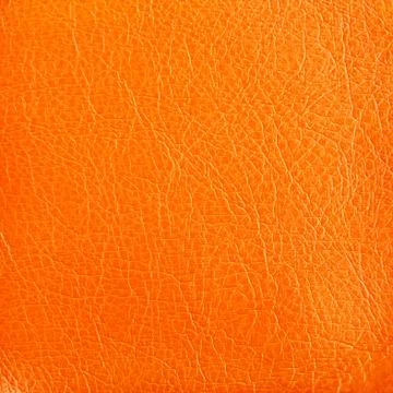 Premium orange leather texture background for decor Stock Photos