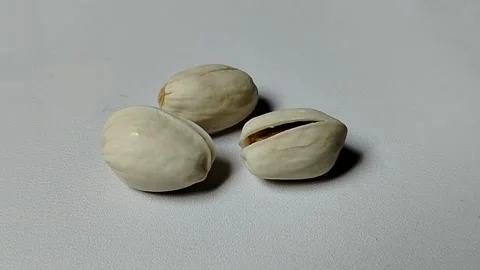 Premium pistachio nuts are nutritious edible seeds native to the Middle East and Stock Footage 337829091