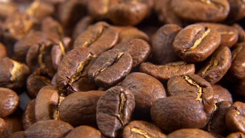 Premium quality light roasted coffee beans rotating macro Stockbeeldmateriaal 122456211