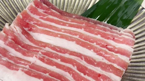 Premium Raw Beef Slices Arranged on Serving Plate Stock Footage 343730427