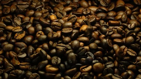 Premium roasted coffee beans, falling coffee beans, macro background 스톡 동영상 334554060