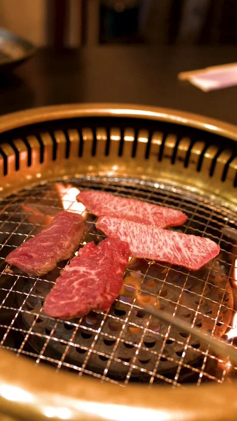 Premium Wagyu Beef Slices Grilling Over Open Flame BBQ Stock Footage 336522258