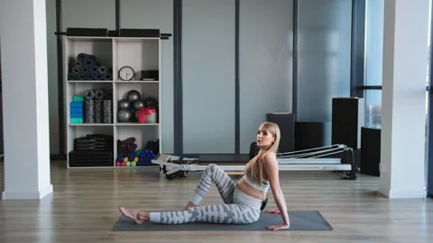 Prenatal Trainer Showcasing Modified Reverse Plank Exercise Stock Footage 272909722