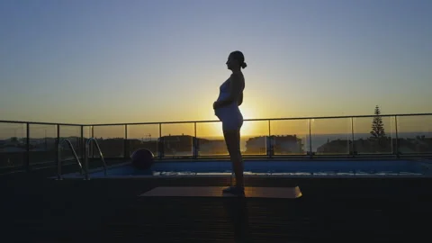 Prenatal Yoga Routine Rooftop Pool Dusk Ocean Stock Footage 319129272