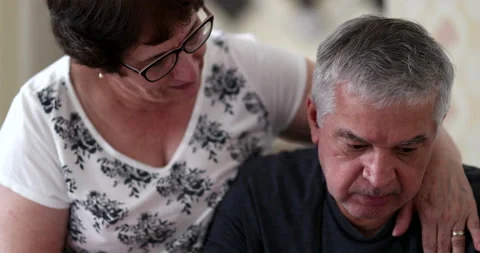 Preoccupied senior man seeking help and support. Wife consoling older husband Stock Footage 141347205