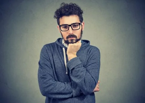 Preoccupied young man thinking thoroughly Stock Photos
