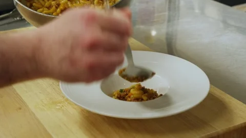 Prep kitchen plating food ready to be served to guest. Restaurant Stock Footage 345005094