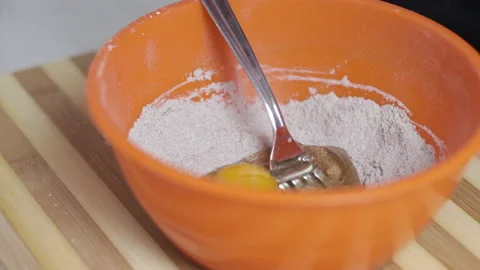 Prepairing a cake for breakfast, closeup shot. Caucasian hands Video stock 200929175