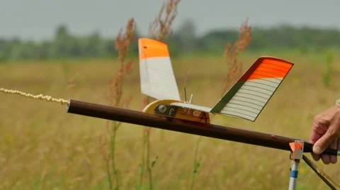 Preparation an Aircraft Model to the Launch Boy and Instructor Setting a Model Stock Footage 64580300