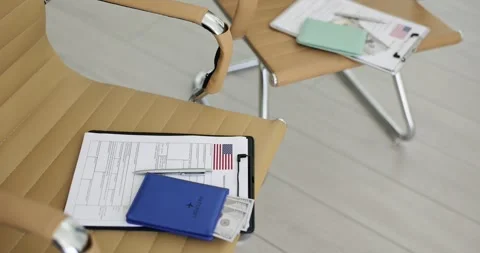 Preparation of all documents for obtaining a US visa on chair at embassy Stock Footage 249877460