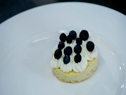 Preparation and decoration dessert biscuit, cream and berries Stock Footage 71134580
