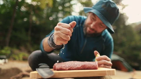 Preparation and marinating of meat in the open air during a tourist trip Stock Footage 256156514