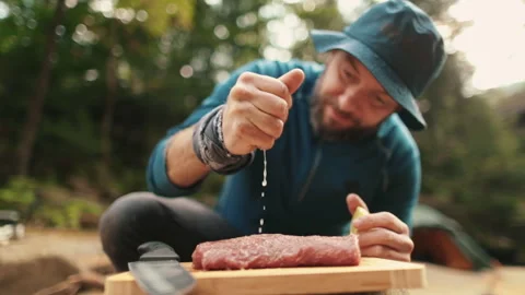 Preparation and marinating of meat in the open air during a tourist trip Stock Footage 256156678