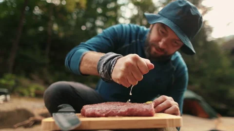 Preparation and marinating of meat in the open air during a tourist trip Stock Footage 256156730