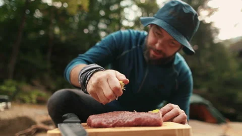 Preparation and marinating of meat in the open air during a tourist trip Stock Footage 256156808