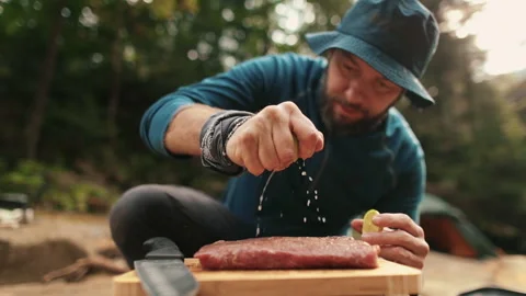 Preparation and marinating of meat in the open air during a tourist trip Stock Footage 256156881