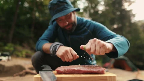 Preparation and marinating of meat in the open air during a tourist trip Stock Footage 256156953