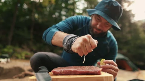 Preparation and marinating of meat in the open air during a tourist trip Stock Footage 256156987