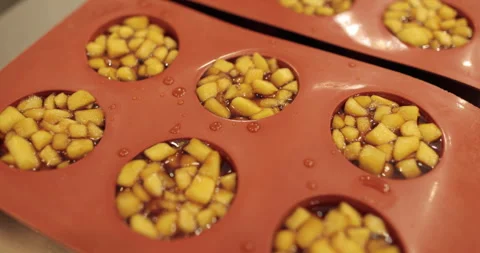 Preparation of apple desserts in a silicone baking tray. Stock Footage 263484554