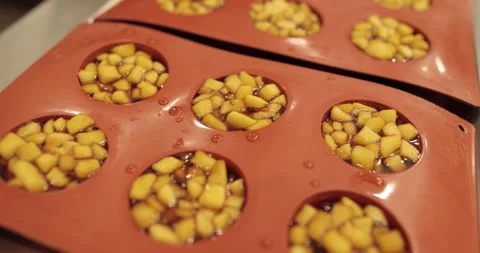Preparation of apple desserts in a silicone baking tray. Stock Footage 263484734