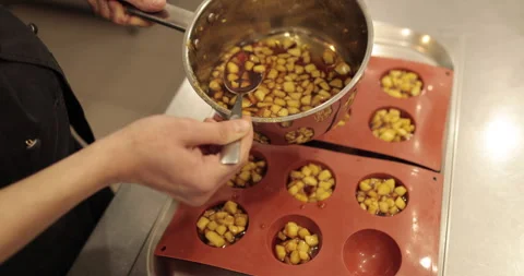 Preparation of apple desserts in a silicone baking tray. Stock Footage 263486232