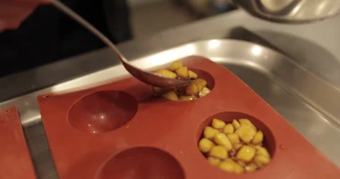 Preparation of apple desserts in a silicone baking tray. Stock Footage 263487774