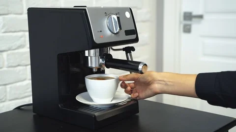 Preparation of aromatic coffee. Women's hands preparing a drink. Stock Footage 100366796