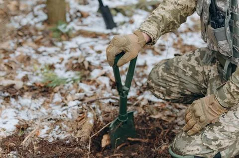 Preparation for the attack. Digging a trench. Stock Photos