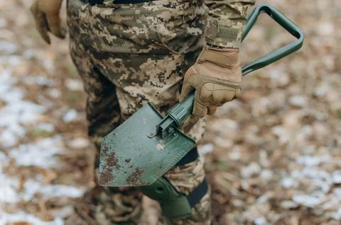 Preparation for the attack. Digging a trench. Stock Photos